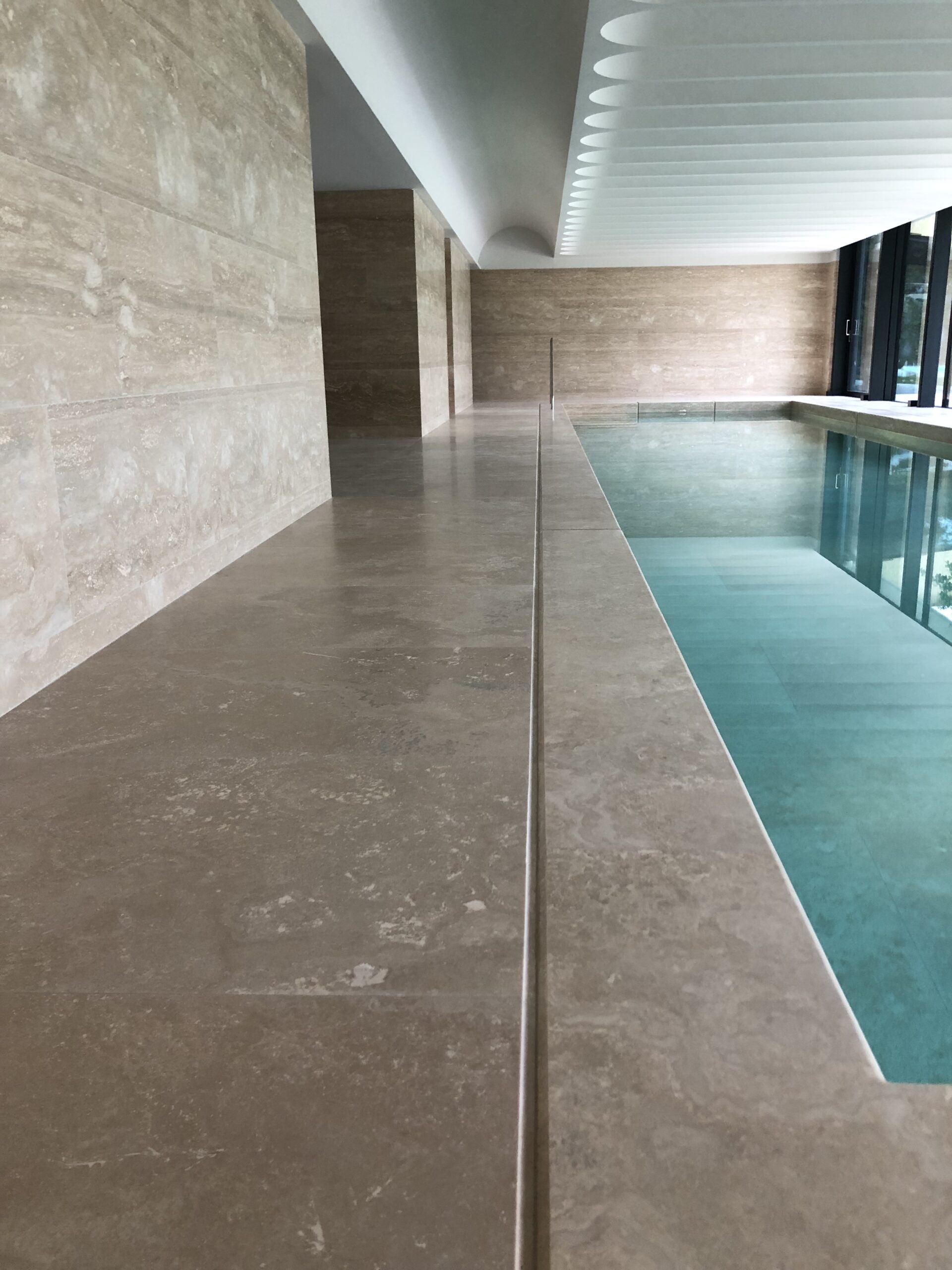 - AFJONES Stonemasons Travertine marble poolside natural stone.